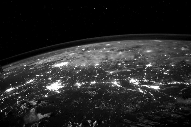 City lights across the Earth at night seen from space, representing 5G network coverage